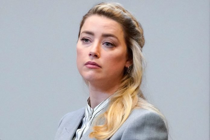 Amber Heard hires another lawyer in bid to force two insurance firms to pick up her $15m legal bill