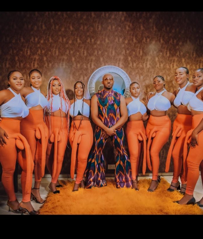 Pretty Mike arrives with women wearing large p*nis pants as he attends Don Jazzy's mother funeral (video)