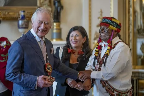 King Charles is gifted a colourful necklace from an indigenous leader ...