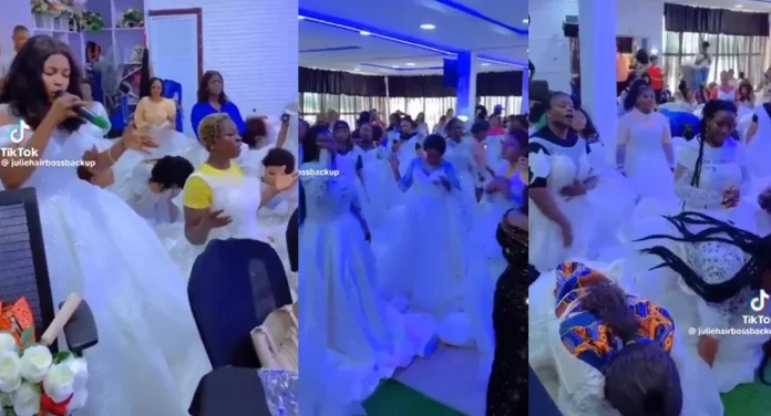 Single Women Spotted Wearing Wedding Gowns While Praying For Husbands At A “Spiritual Event” (Video)