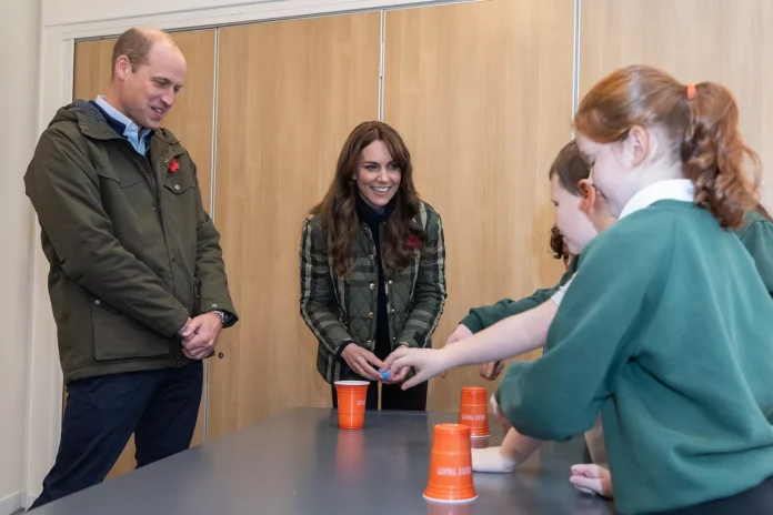 Prince William Teases Kate As She Struggles To Bounce A Ball Into Cup