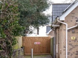 Fury As Vigilante Neighbour Who Built 8ft Fence Nicknamed The 'Great Wall Of Colchester' To Keep Yobs And Drug Dealers Out Of Newbuild Estate Is Ordered To Tear It Down