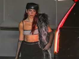 Dua Lipa Dons A Petite Silver Crop Top, Revealing Her Toned Abs, And Pairs It With Fishnet Gloves For The Met Gala Afterparty